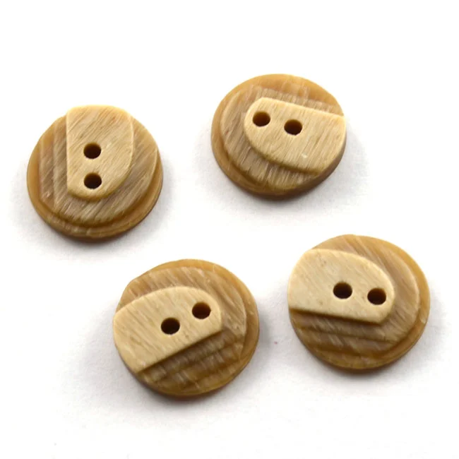 Modeknopf mit stufenförmigen Erhöhungen 18 mm beige von Dill Echt